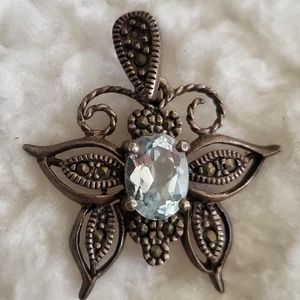 Vintage Necklace pendant with light blue stone in the center of butterfly